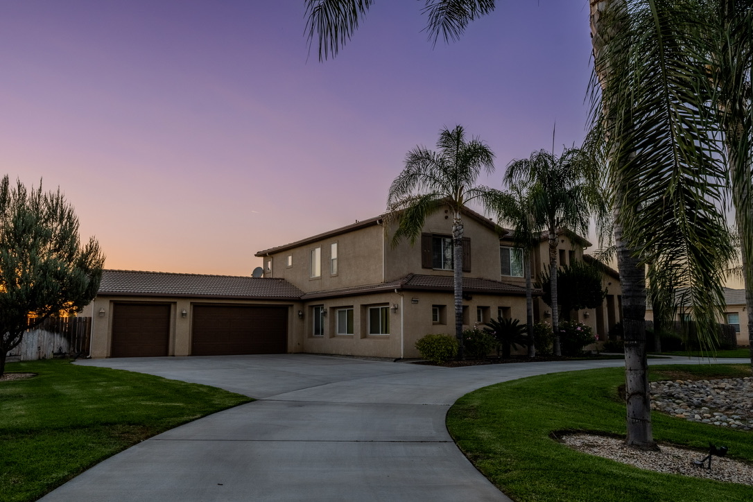 Twilight luxury home exterior illumination